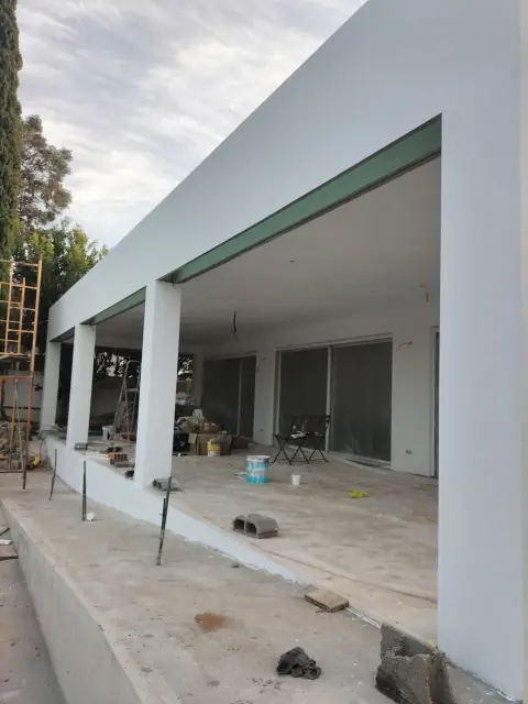 Exterior painting of a villa with a veranda — photograph 13